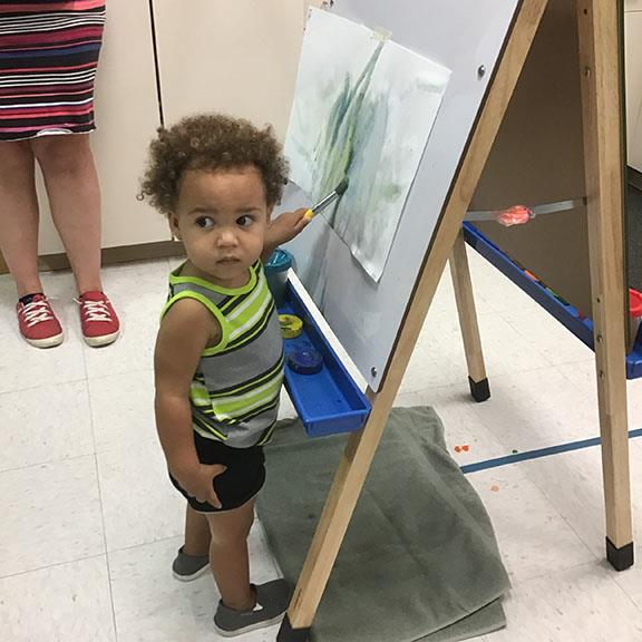 Young child painting